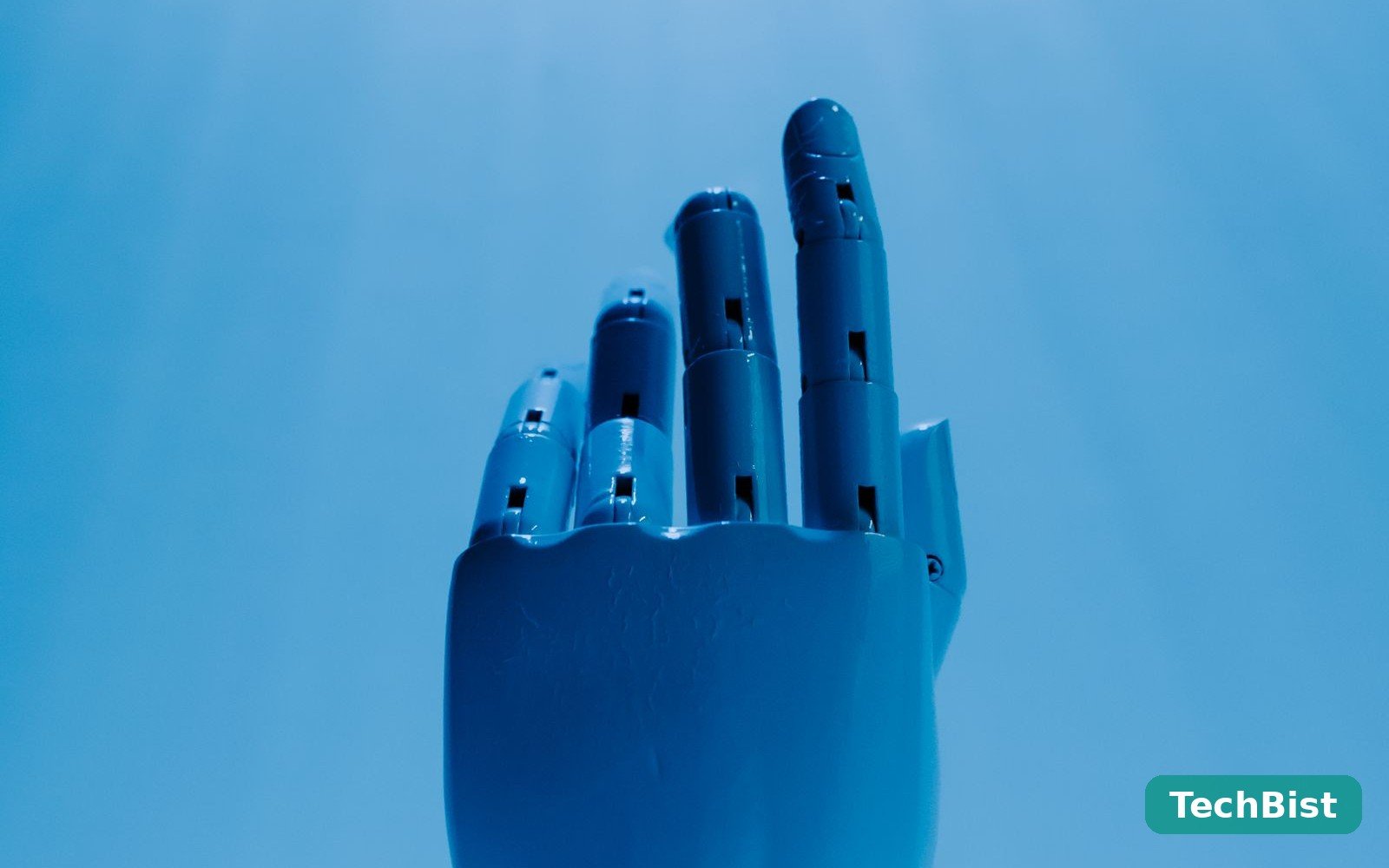 A robotic hand reaching out against a blue sky, representing an AI agent at work