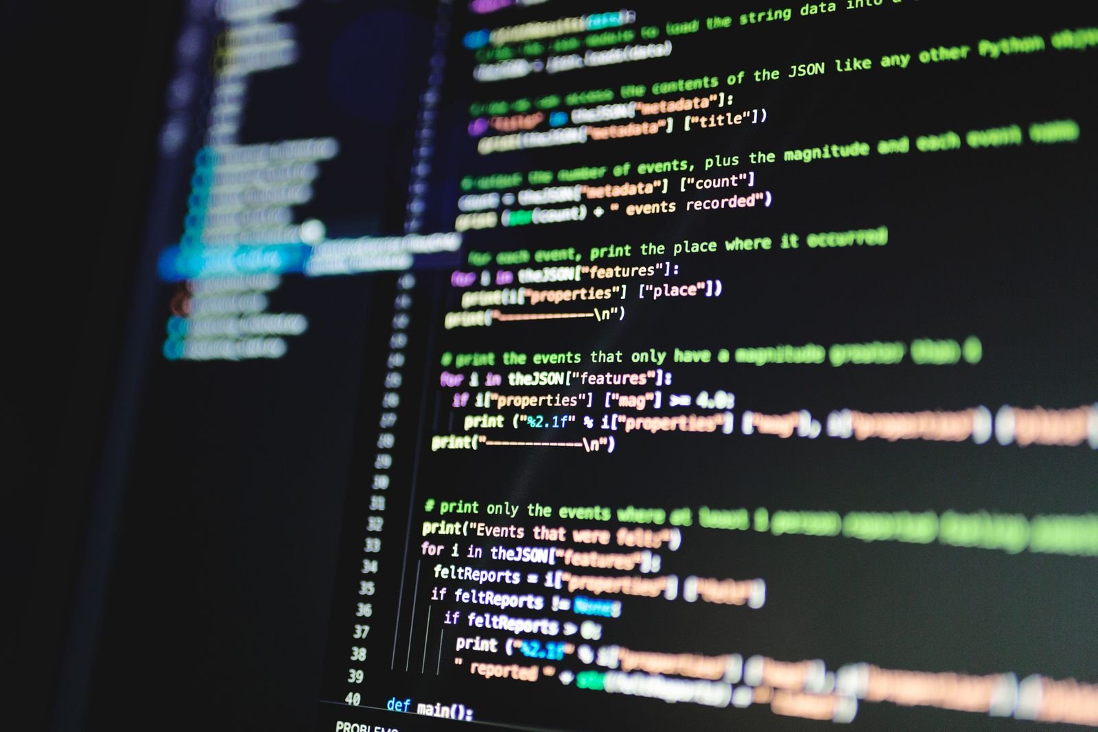Close-up of colorful programming code on a monitor with a dark background