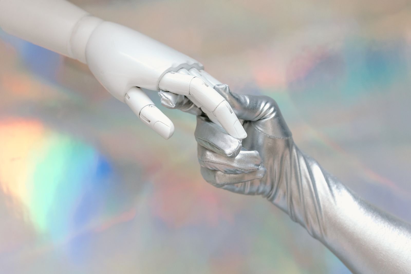 A robot hand touching a human hand, symbolizing human-robot collaboration